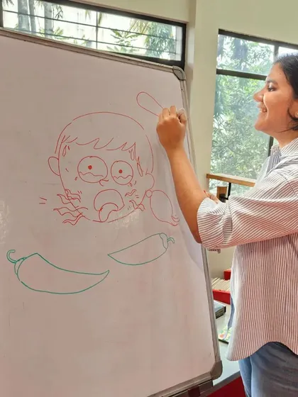 Illustrator Vibha Surya live-drawing a character from the book. This is one of my favorite parts of author events, as it shows kids the magic of how book characters come to life.