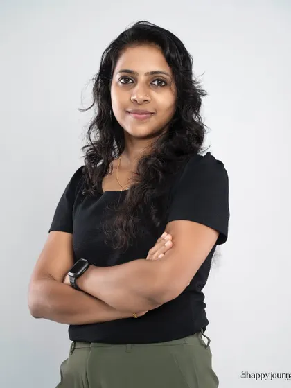 This headshot uses a classic crossed-arms pose to communicate confidence and expertise. The simple background and studio lighting ensure a sharp, professional look suitable for any corporate or business use.