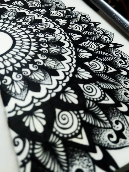 Another perspective on my half-mandala, showing the texture of the ink on paper. I offer workshops for anyone interested in learning the basics of this art form.