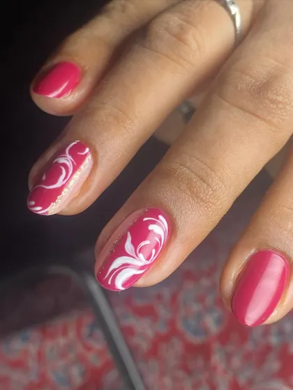 The swirl art on these nails is completely hand-drawn for a unique touch.