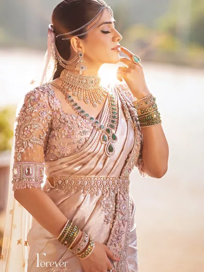 A close-up of the bride's stunning look. The hand-embroidered saree, blouse, and delicate veil come together to create a work of art.