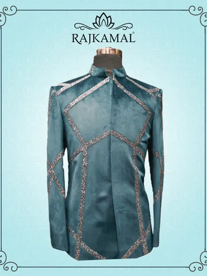 A stylized shot of the teal velvet jacket, framed to highlight its unique design.