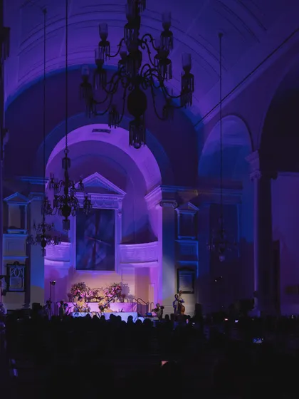 The venue bathed in purple light, demonstrating how I use lighting to create a specific mood for an event.