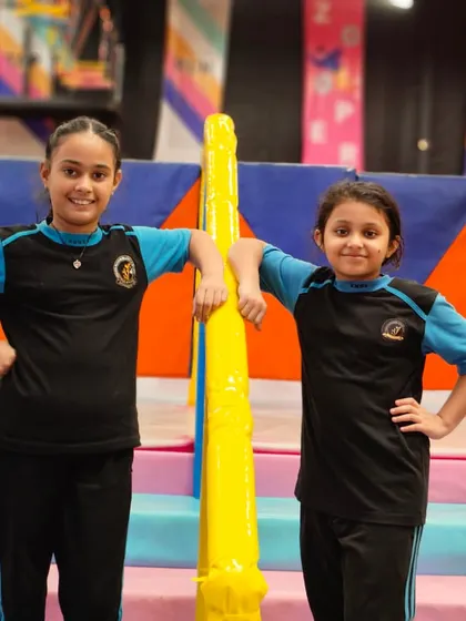 Two friends posing for a photo in the soft play area. It’s a great space for kids to interact and have fun.