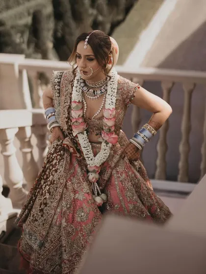 A candid shot that captures the movement and detail of her outfit. The makeup and hair were designed to look stunning from every angle, whether in posed portraits or in-motion shots.