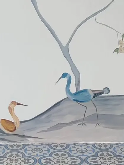 A duplicate image of the cranes at the bottom of the mural.