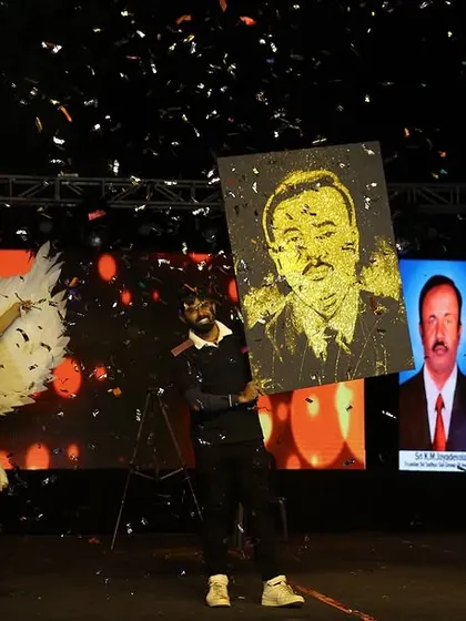 The grand finale of a speed painting performance, with confetti falling as the glitter portrait is presented. This is how I turn art into a full-blown celebration.