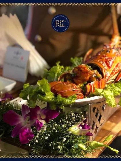 Another view of the exquisite grilled lobster appetizer. This dish highlights our expertise in preparing high-end seafood and creating visually spectacular culinary presentations for luxury weddings.
