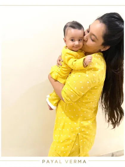 Even bedtime can be a stylish affair. We created these matching yellow polka-dot nightsuits for a mother and her baby, ensuring they are both comfortable and cute for their evening cuddles.
