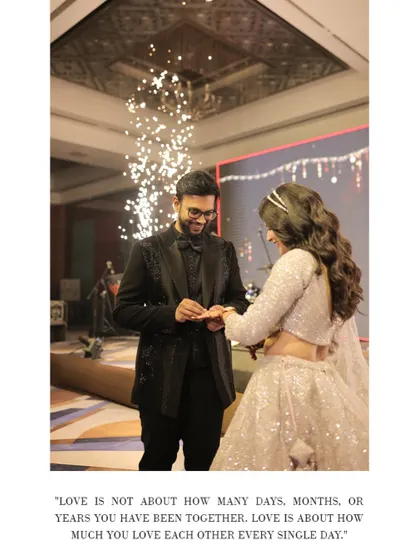 A wide shot of the ring ceremony, capturing the grand stage, the fireworks, and the couple's promise. It's a beautiful testament to their love story.