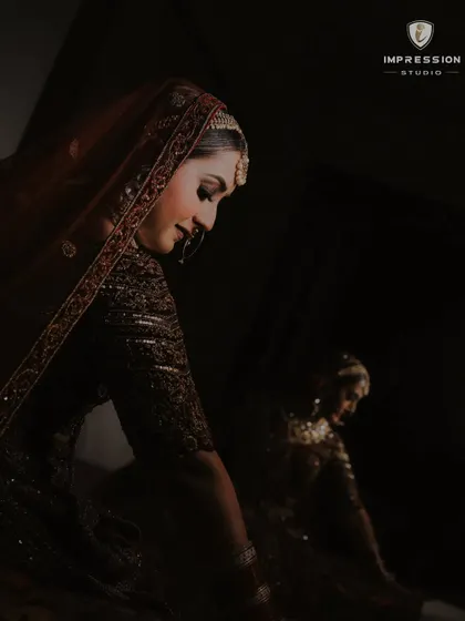 Bride's Radiance. A glimpse of timeless elegance in this black and white portrait, with her reflection adding depth.