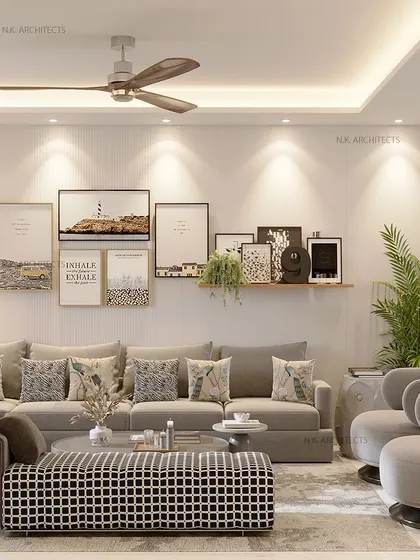 This living room is designed for serene comfort. We used a soft, neutral color palette with a large sectional sofa, a gallery wall for a personal touch, and layered lighting to create a warm and inviting atmosphere for the family.
