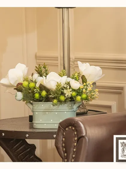Every petal tells a story of eternal beauty in my artificial bloom collection. This small arrangement in a mint green polka-dot pot adds a cheerful and charming touch to a side table.