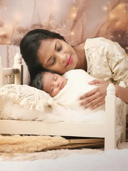 The bond between a mother and her newborn is a story I feel privileged to capture. In our cozy studio, I create a serene and warm environment for these tender moments, focusing on the quiet love and connection.