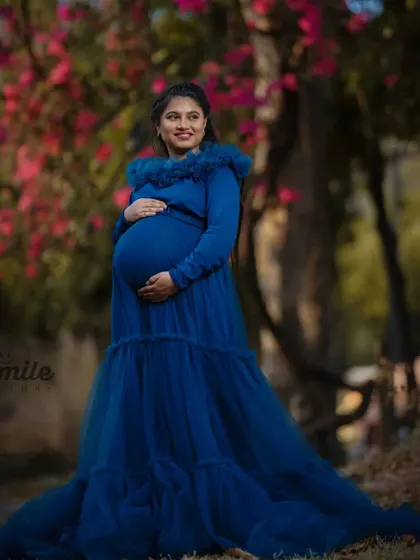 My beautiful client Jeeva glowing in the "Teel Tweety" gown. The ruffled neckline adds a soft, feminine touch to this popular maternity dress.