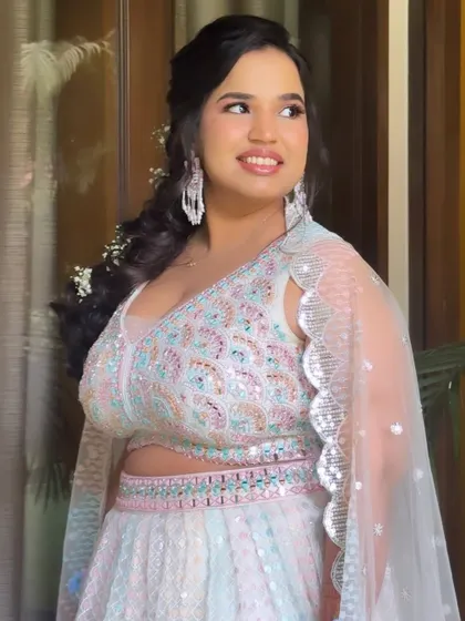 A beautiful portrait of Ramya's Haldi look. The makeup is light and airy, perfect for a daytime celebration.