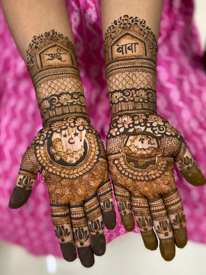 A baby shower mehendi design that honors the grandparents, with 'Aai' and 'Baba' written in beautiful script.