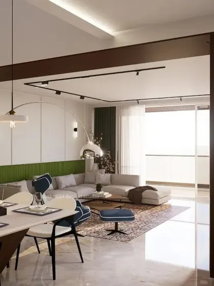 This is what I call luxe vibes without the extra bling. The dining area is framed by a dark wood portal, creating a clear distinction from the living room while maintaining an open connection. The green accent wall and bold wallpaper add personality and color.