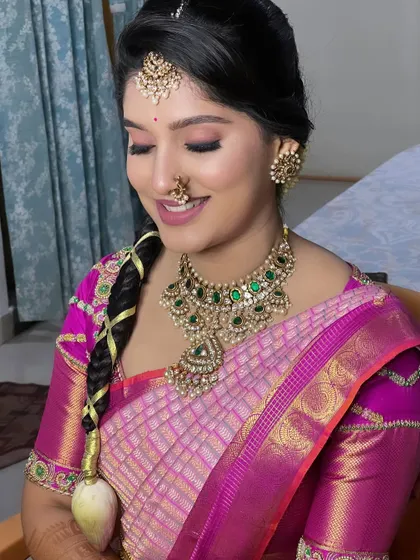 A close-up of the bride's makeup, showing the soft pink eyeshadow and flawless skin. This is a versatile look that can be adapted for many different occasions.