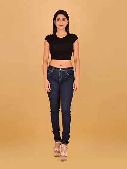 A full-length shot for a model's portfolio. The makeup is understated to demonstrate how the model looks naturally, providing a blank canvas for future photoshoots and campaigns.