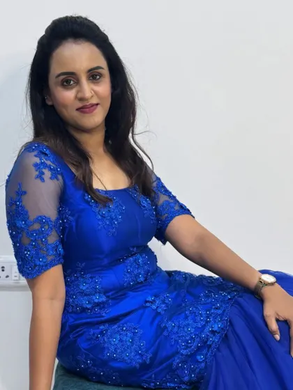 Feeling the festive vibes in my custom royal blue gown, designed with delicate floral embroidery on the bodice and sleeves.