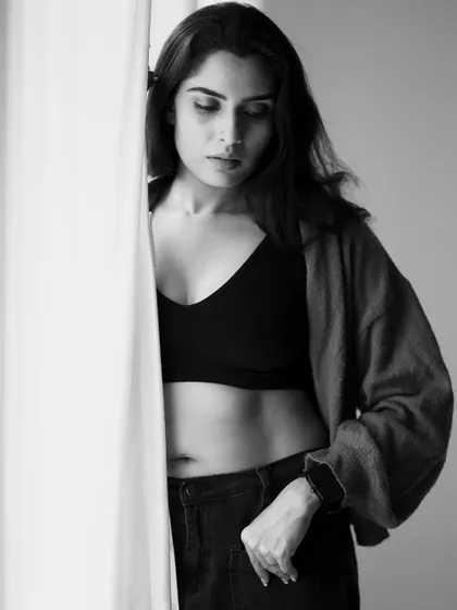 A powerful and direct gaze. This black and white conversion gives the portrait a raw and honest quality.