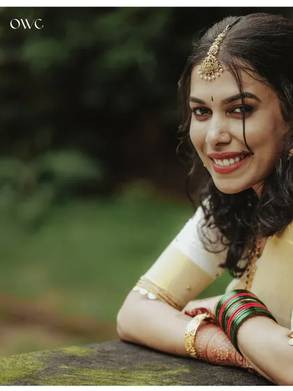 A bright and happy close-up of the bride, her smile radiant.