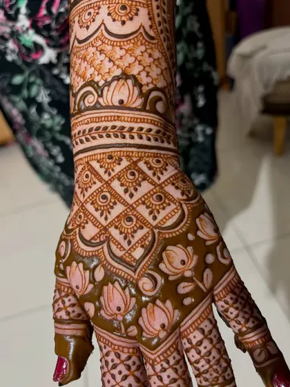 The beautiful stain of Chaitra's wedding mehendi, with the lotus patterns now a deep, rich color.