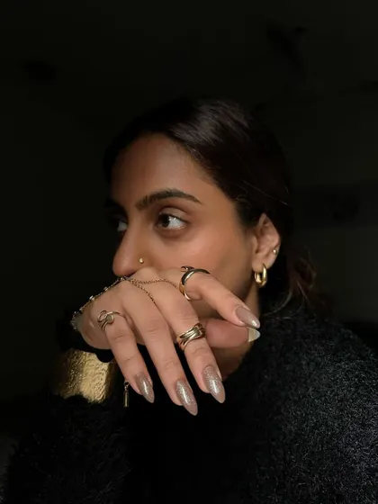 A moody shot of our coffee-inspired nails. The mocha mousse color looks stunning in any light.