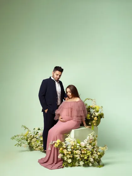 A soft, pastel-themed studio shoot with a floral setup. This style is perfect for a romantic and gentle aesthetic.