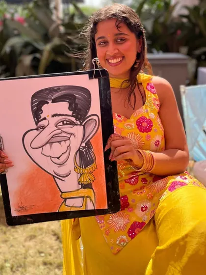 A guest in a beautiful yellow outfit for a Haldi ceremony, with a caricature to match.