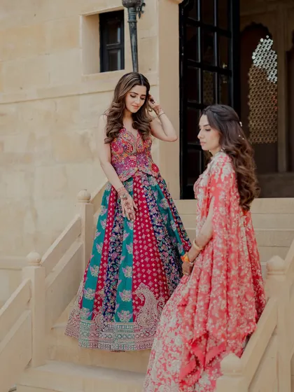 The Taaran lehenga set, worn here by Isha Multani, is a beautiful example of modern bridal wear. The vibrant, multi-tonal skirt paired with an intricately embroidered blouse creates a look that is joyful and unique.