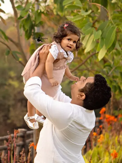 The pure joy on a father's face as he plays with his little girl. These are the candid, heartfelt moments we strive to capture in every family session.