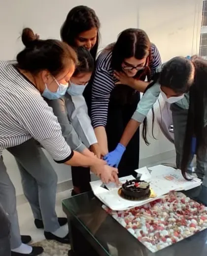 The whole team joining in for a cake cutting. These celebrations bring us closer and reinforce our collaborative spirit.