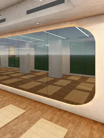 A close-up of the custom-designed viewing window in the yoga hall. The rounded corners and integrated backlighting soften the feature, making it a unique architectural detail that enhances the room's gentle aesthetic.