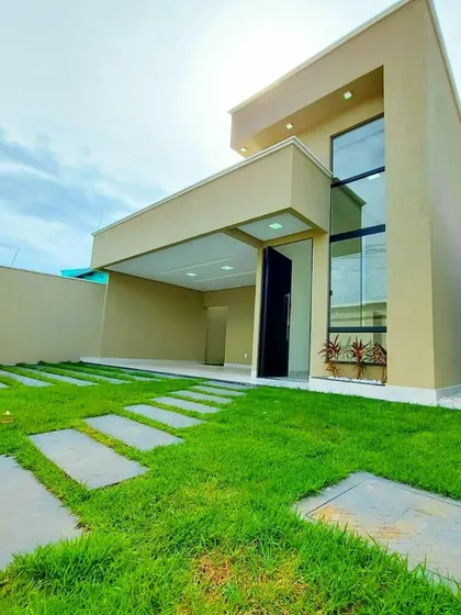 A completed front yard featuring a checkerboard pattern of lawn and pavers. This design provides a durable surface for foot traffic while maintaining the look and feel of a lush front lawn.