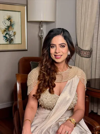 A final, graceful shot of the off-white saree. This look is a perfect example of modern Indian elegance.