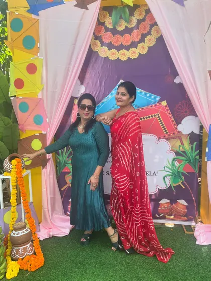 Posing against the festive decor. The colors of my outfit complemented the vibrant background, showing the importance of considering your environment when styling.