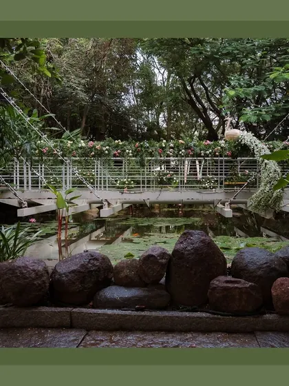 The 'Wishing Bridge' was a key feature of the brunch. It was decorated with floral garlands and a peacock motif, creating a beautiful interactive element for guests.