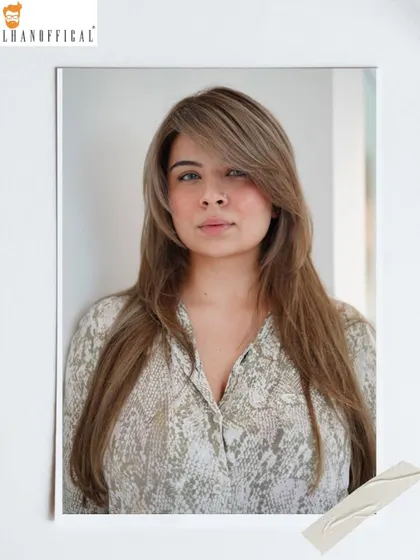 A straight-on view of the ice blonde transformation. The side-swept bangs and soft layers complement the cool color, framing the face beautifully.