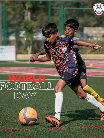 A young player in action, celebrating World Football Day and the universal love for "The Beautiful Game."
