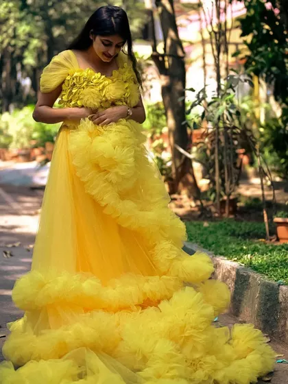 A beautiful yellow ruffle gown, perfect for a sunny outdoor photoshoot.