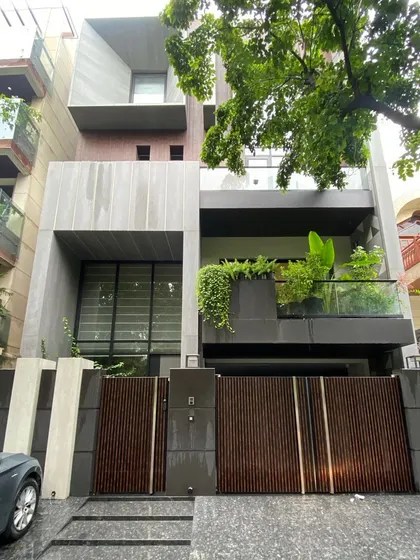 A photograph of a finished modern home, demonstrating the clean lines and material quality we deliver. This is the end result of a carefully planned design and build journey.