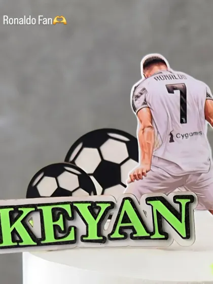 A detail shot of the Ronaldo-themed cake, personalized with the name 'Keyan'. Perfect for a young football enthusiast.