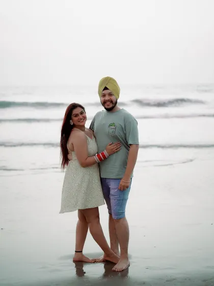 A joyful portrait by the sea. This photo captures the couple's happiness and the relaxed vibe of their post-wedding getaway.