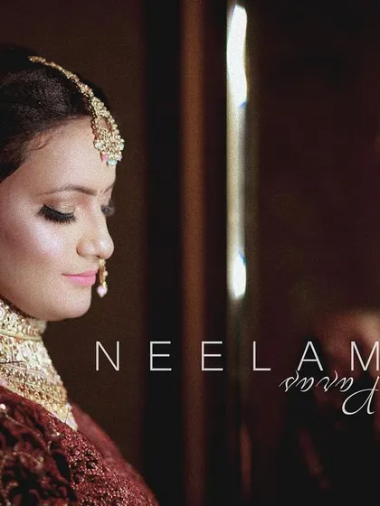 A beautiful getting-ready portrait of the bride, captured in a quiet moment of reflection. The soft lighting and her serene expression make this a timeless shot.