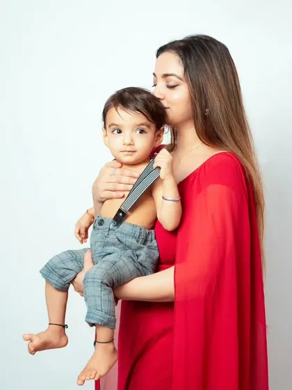 A mother's tender kiss for her son. These simple, loving gestures make for the most beautiful and timeless photographs.