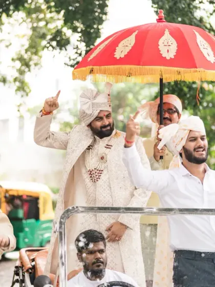 The groom and his friends having a blast during the baraat, dancing on top of a jeep. I plan for high-energy, fun-filled processions.
