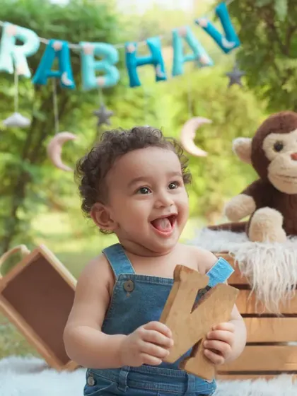 The pure, unfiltered joy of a baby's first birthday celebration outdoors. We set up everything to capture these priceless, happy expressions in beautiful natural light.