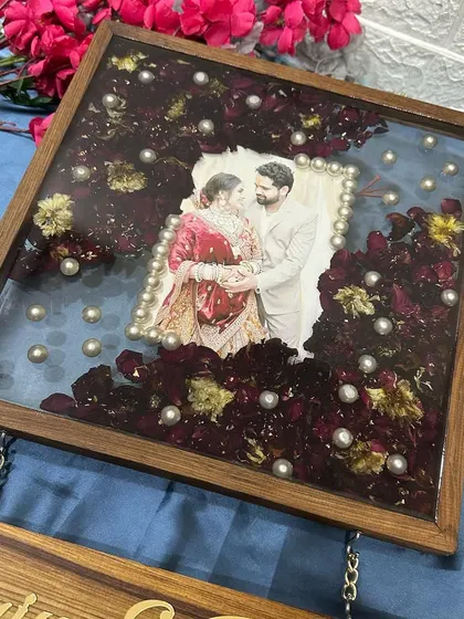 The combination of the resin-filled frame and the hanging wooden plaques makes this a substantial and eye-catching piece of wall decor.